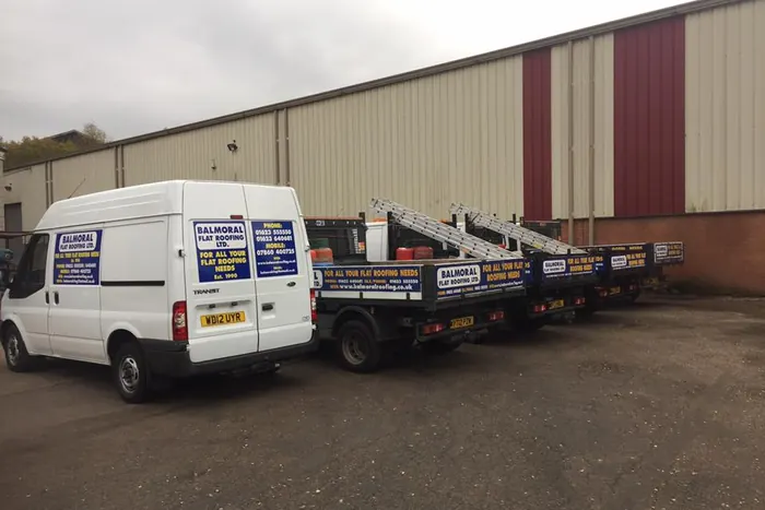 Balmoral Flat Roofing vans and flatbed trailers parked at the Mansfield Woodhouse yard